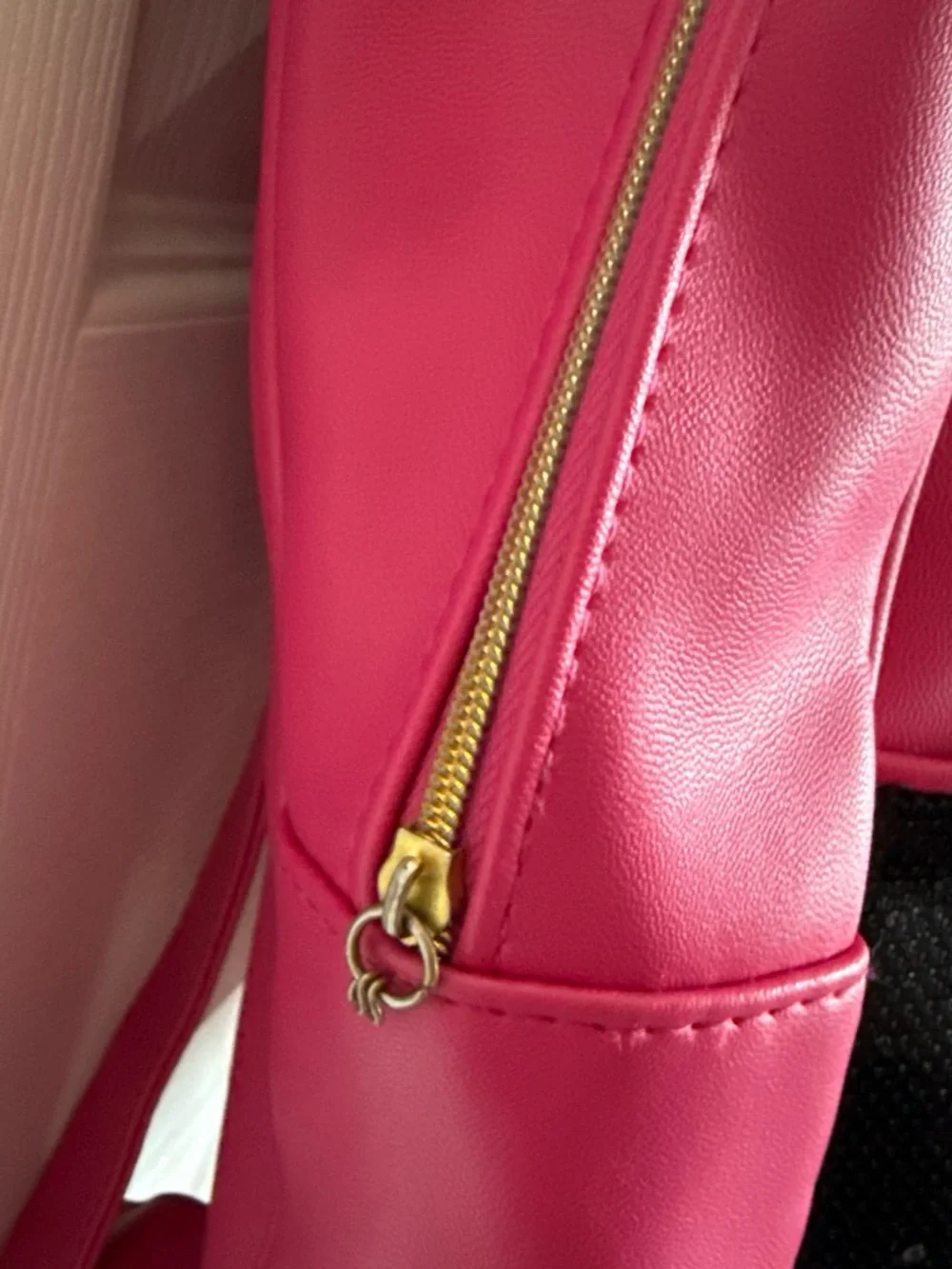 Women's Juicy Couture Hot Pink and Black Sequin backpack with gold detailing.
